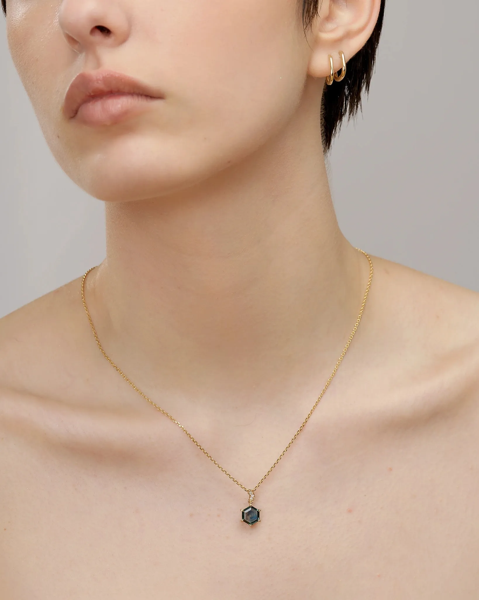 Hexagonal Montana Sapphire Pendant in Fairmined 14K Yellow Gold adorned with lab-grown diamonds.